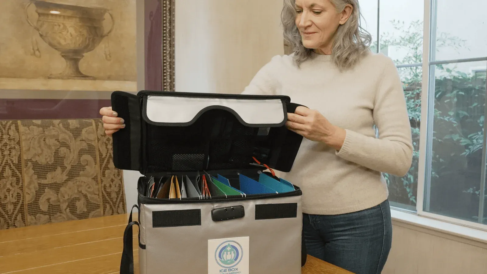 a woman closing the lid to the ICE BOX ensuring life insurance protection