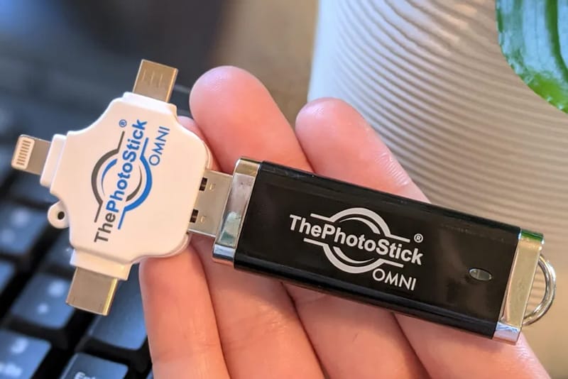 PhotoStick Omni connected to a laptop, saving thousands of images and videos with one click