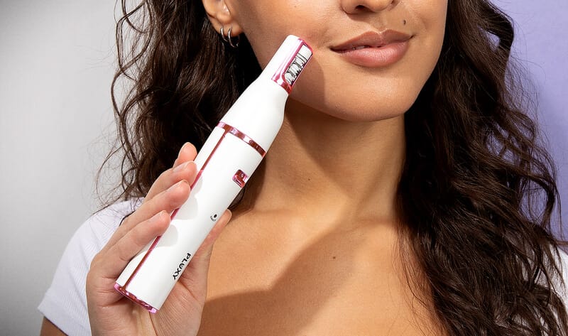 Woman using Pluxy for hair removal, laser waxing